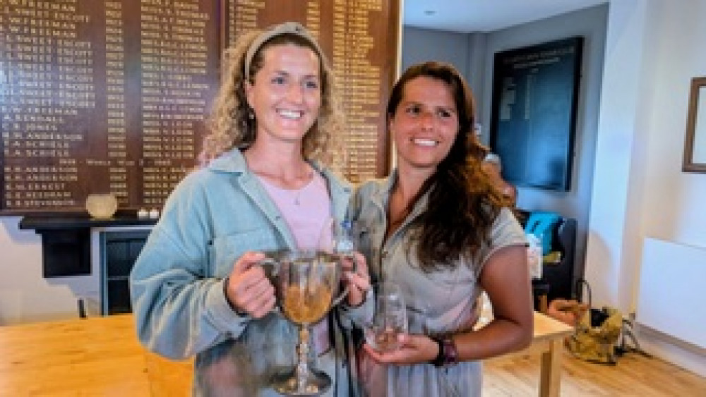  Becks Thehearne (left)  and Amelia Beer collect their prizes at the busy Saturday  night awards ceremony.