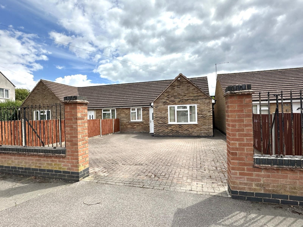 Attractive two-bedroom semi-detached bungalow with driveway parking for multiple cars