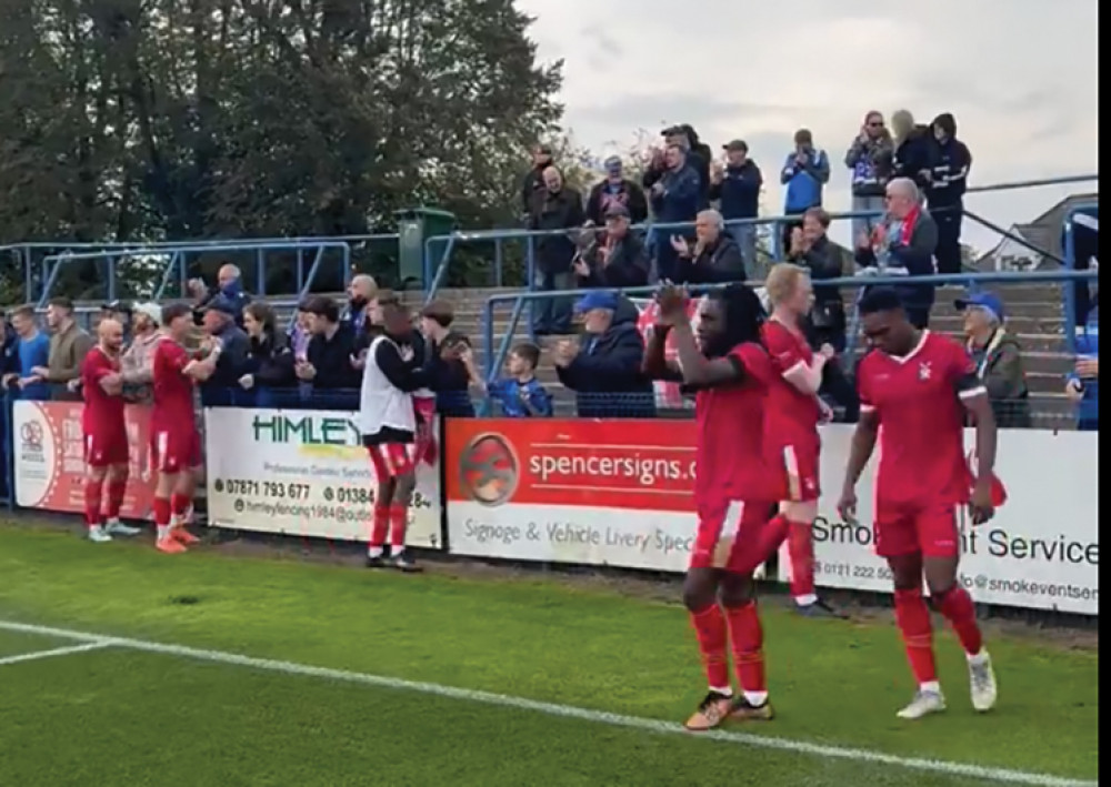 Aveley players with travelling fans after the match