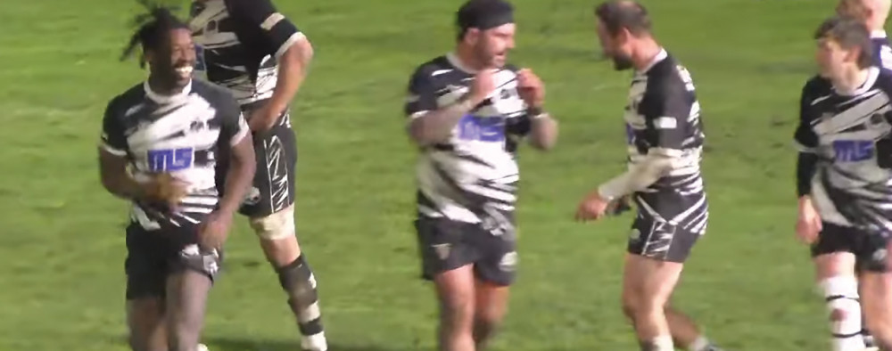 Nat Farrell, left, celebrates his third try.