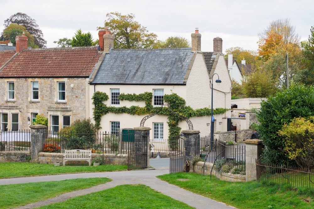 Charming Grade II listed period home in the heart of Wedmore village — ivy‑clad frontage, classic windows and church just across the way.