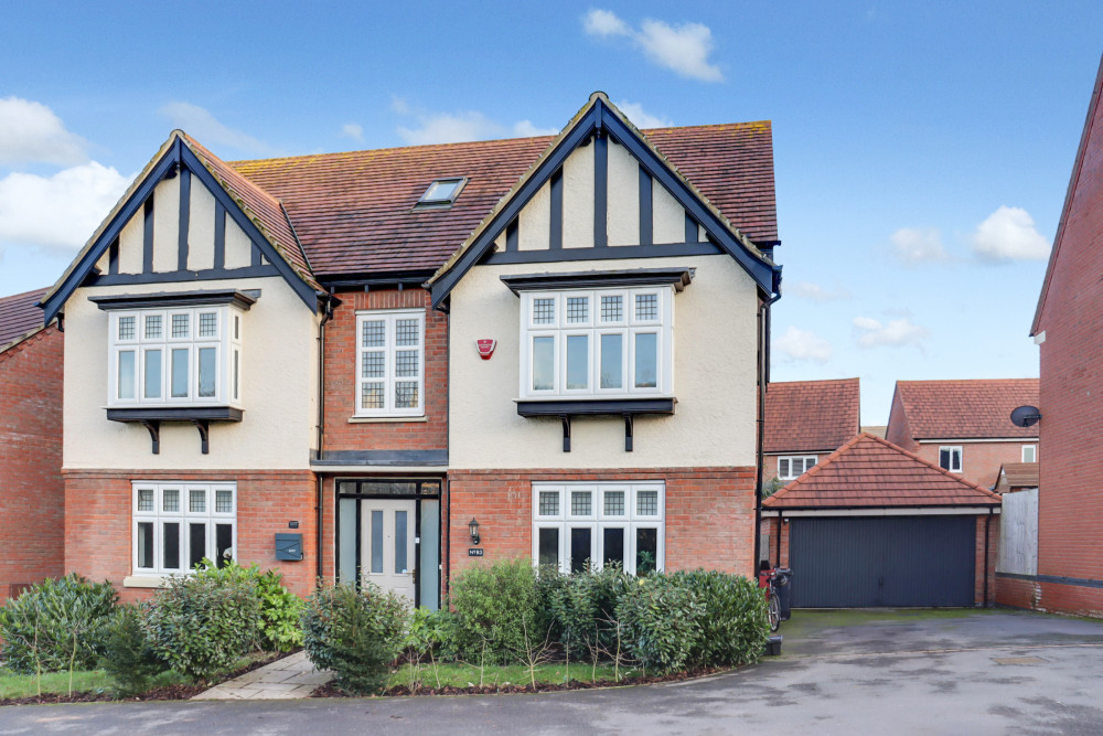 An impressive Davidson ‘Thorne’ home with striking facade, landscaped frontage and private driveway overlooking green space
