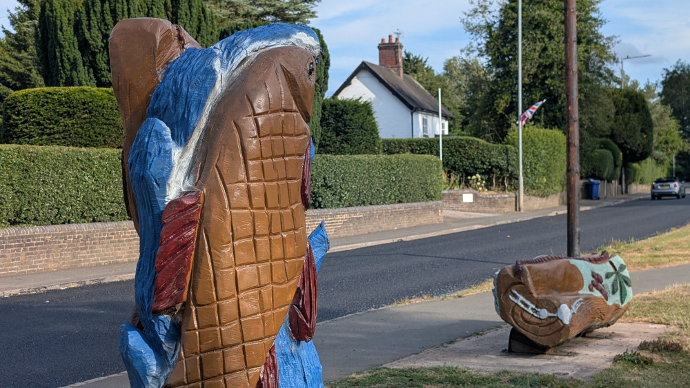Residents attend meeting over controversial painting of memorial bench and fish sculpture